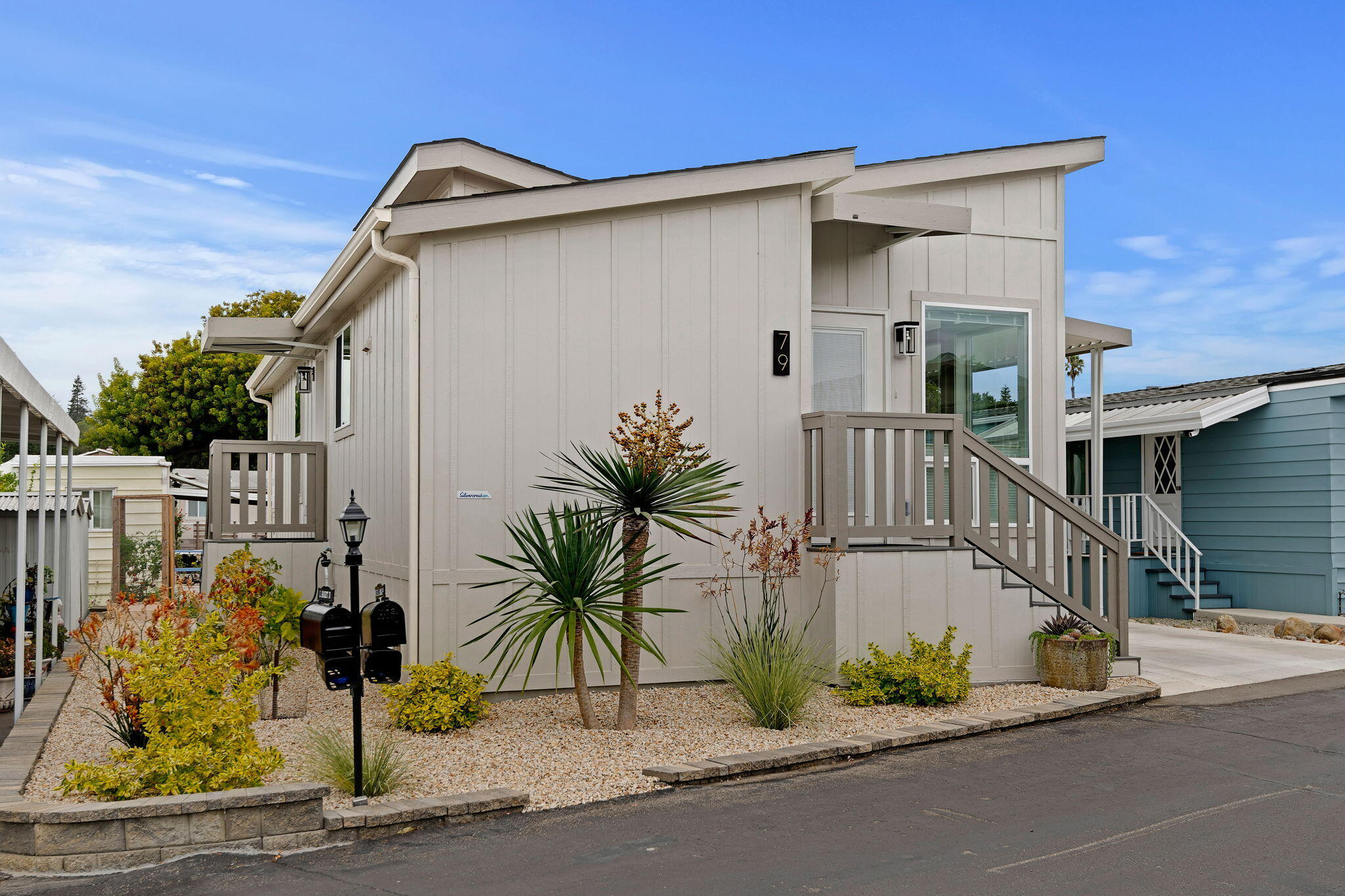 333 Old Mill Road, Unit SPC 79 Santa Barbara, CA 93110 - Photo 2 of 30 a house with a glass door and potted plants