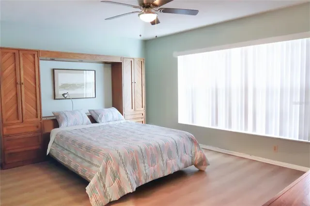 a bedroom with a bed and window