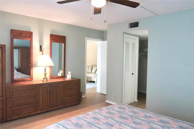 a spacious bathroom with a double vanity sink and a mirror