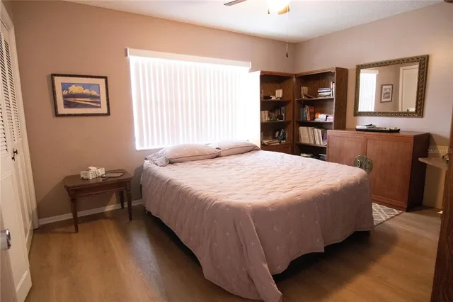 a bedroom with a bed furniture and a window