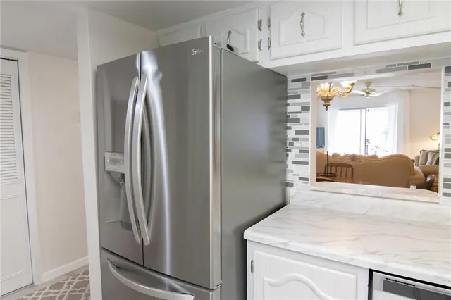 a kitchen with stainless steel appliances a refrigerator and a sink