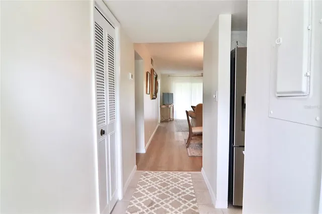 a view of a hallway with a wooden floor
