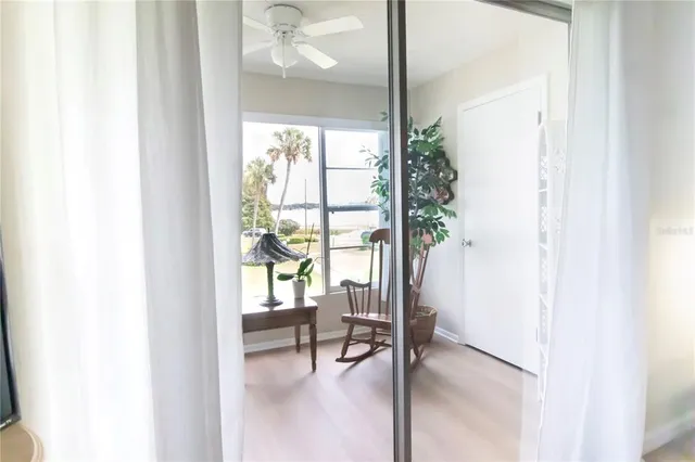 a view of a livingroom with table and chairs