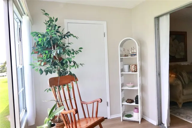 a view of staircase with wooden floor and a potted plant