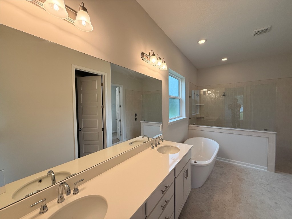 96342 Blackrock Road Yulee, FL 32097 - Photo 18 of 23 a bathroom with a granite countertop sink and a mirror