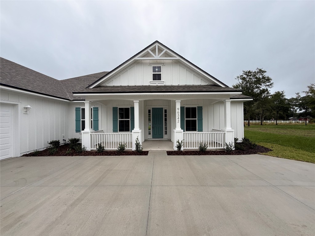 96342 Blackrock Road Yulee, FL 32097 - Photo 2 of 23 a front view of a house with a sitting space