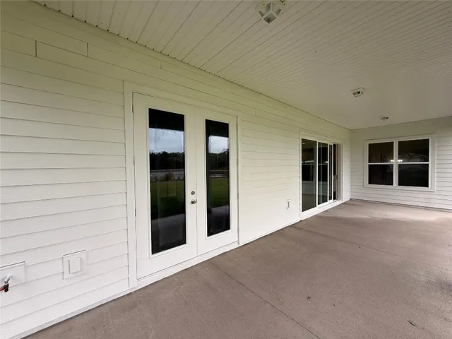 a view of a lake with houses in the background