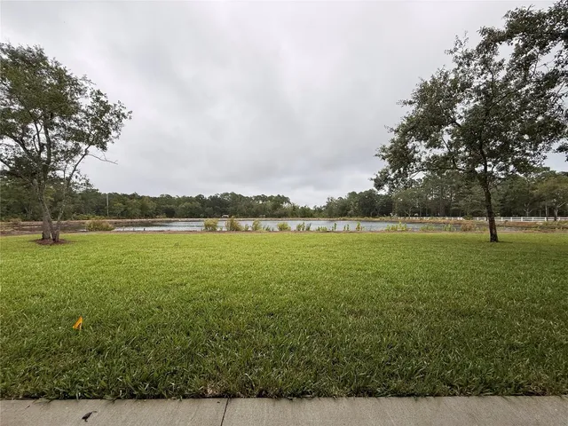 a view of a lake with a big yard