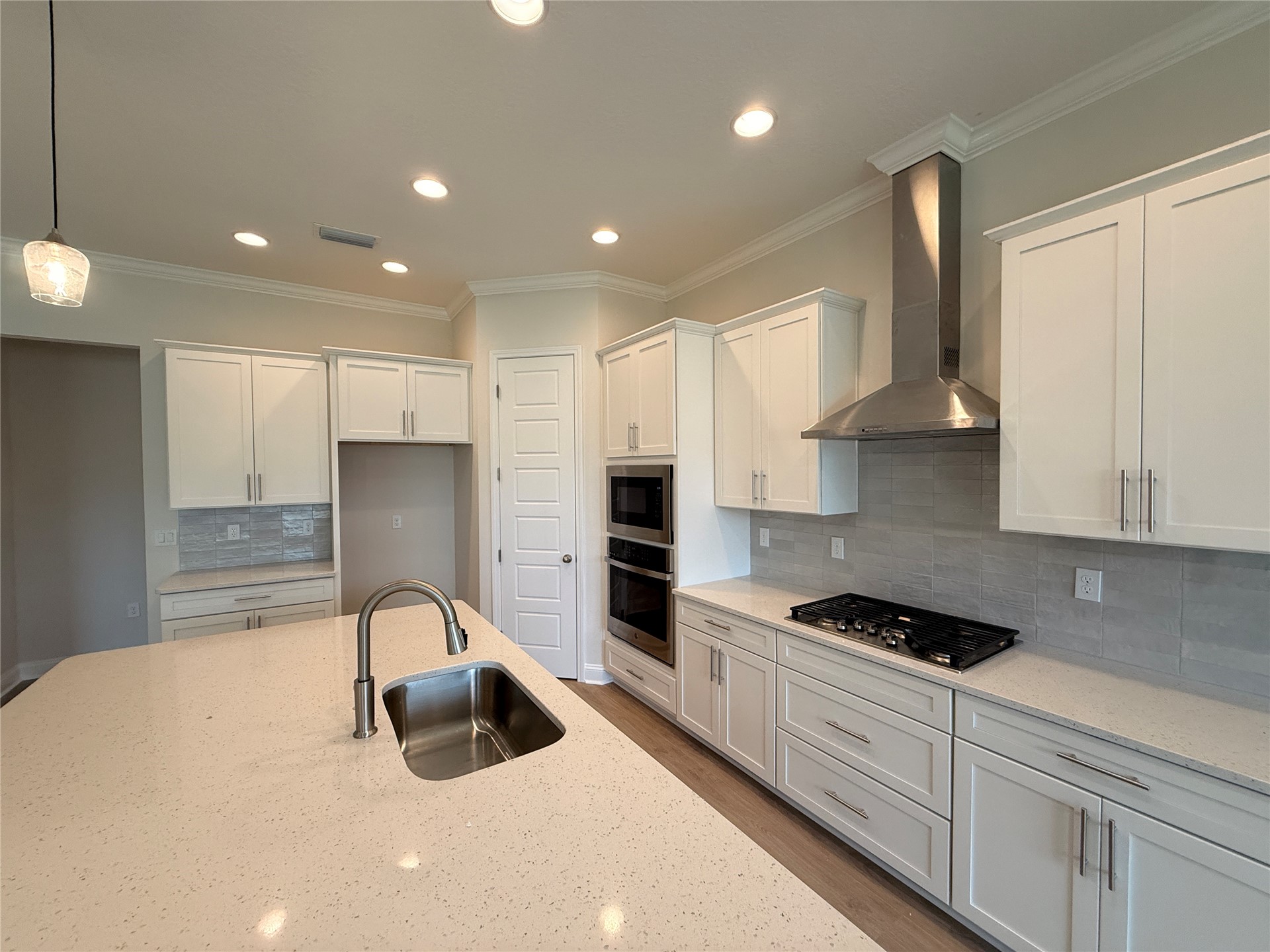 96342 Blackrock Road Yulee, FL 32097 - Photo 7 of 23 a kitchen with granite countertop a sink a stove and refrigerator
