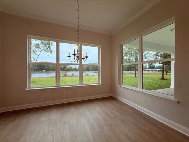 a view of room with window and hardwood floor