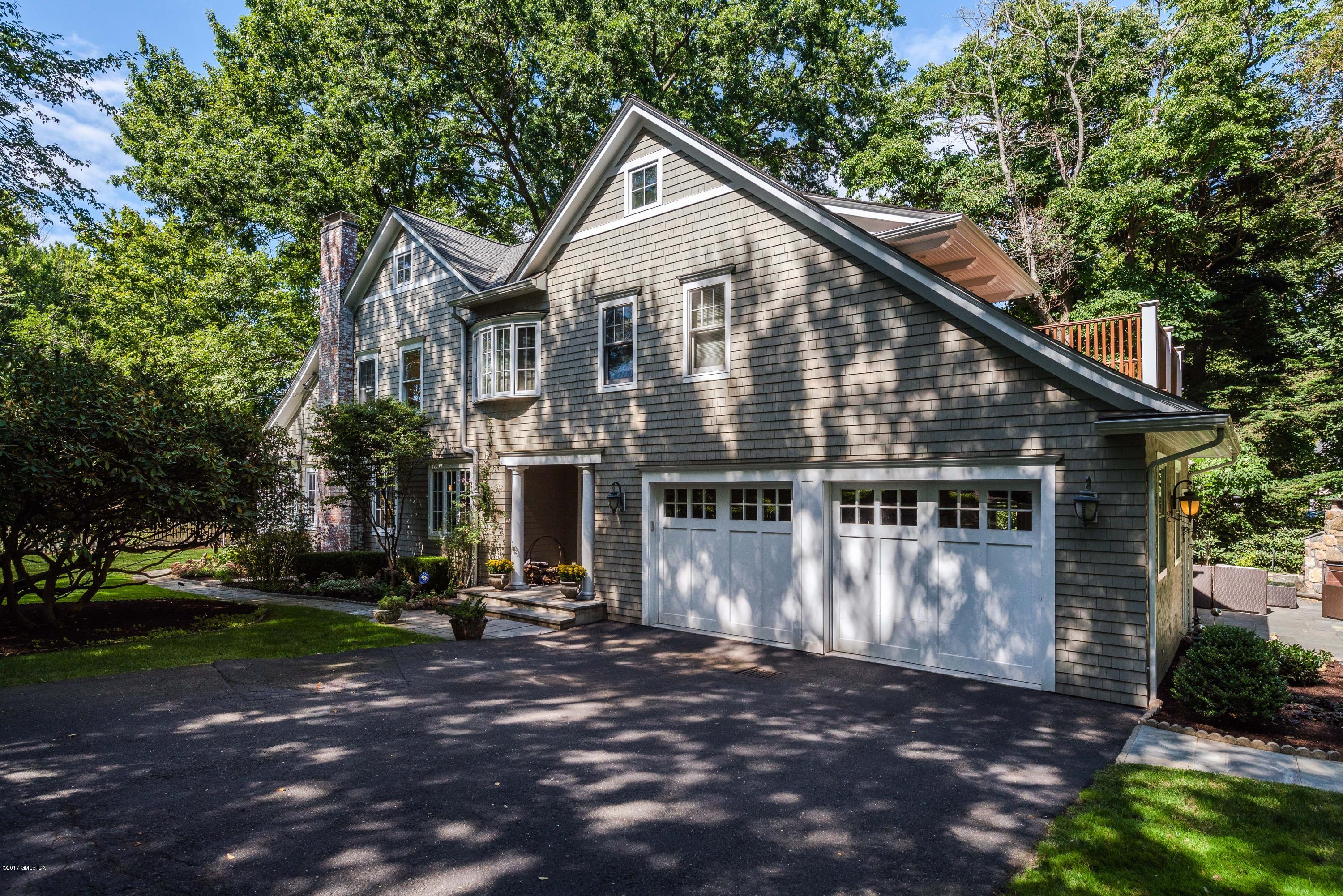 57 Indian Field Road Greenwich, CT 06830 - Photo 1 of 24 a front view of a house with a yard