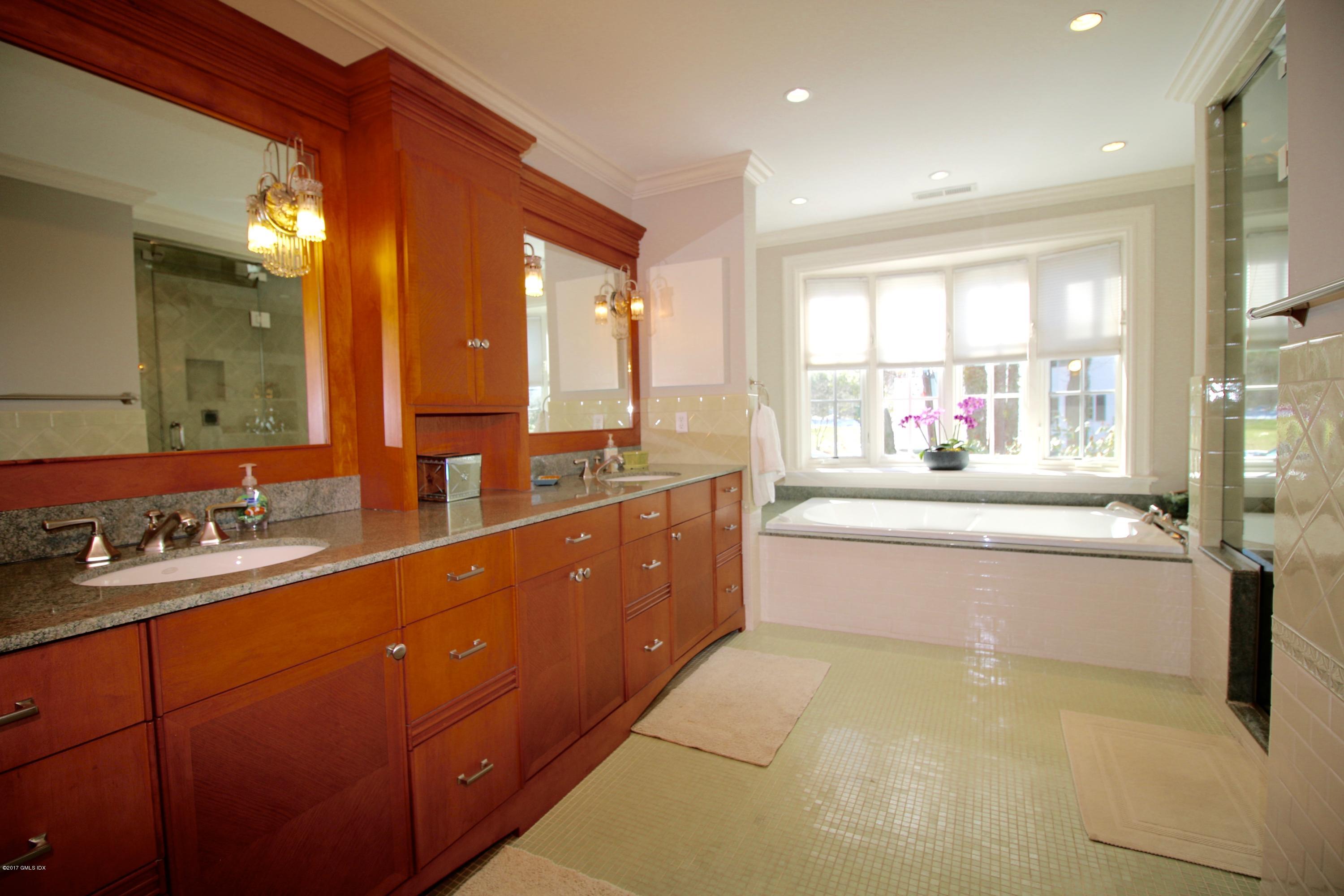 57 Indian Field Road Greenwich, CT 06830 - Photo 14 of 24 a large white kitchen with a large window and double vanity