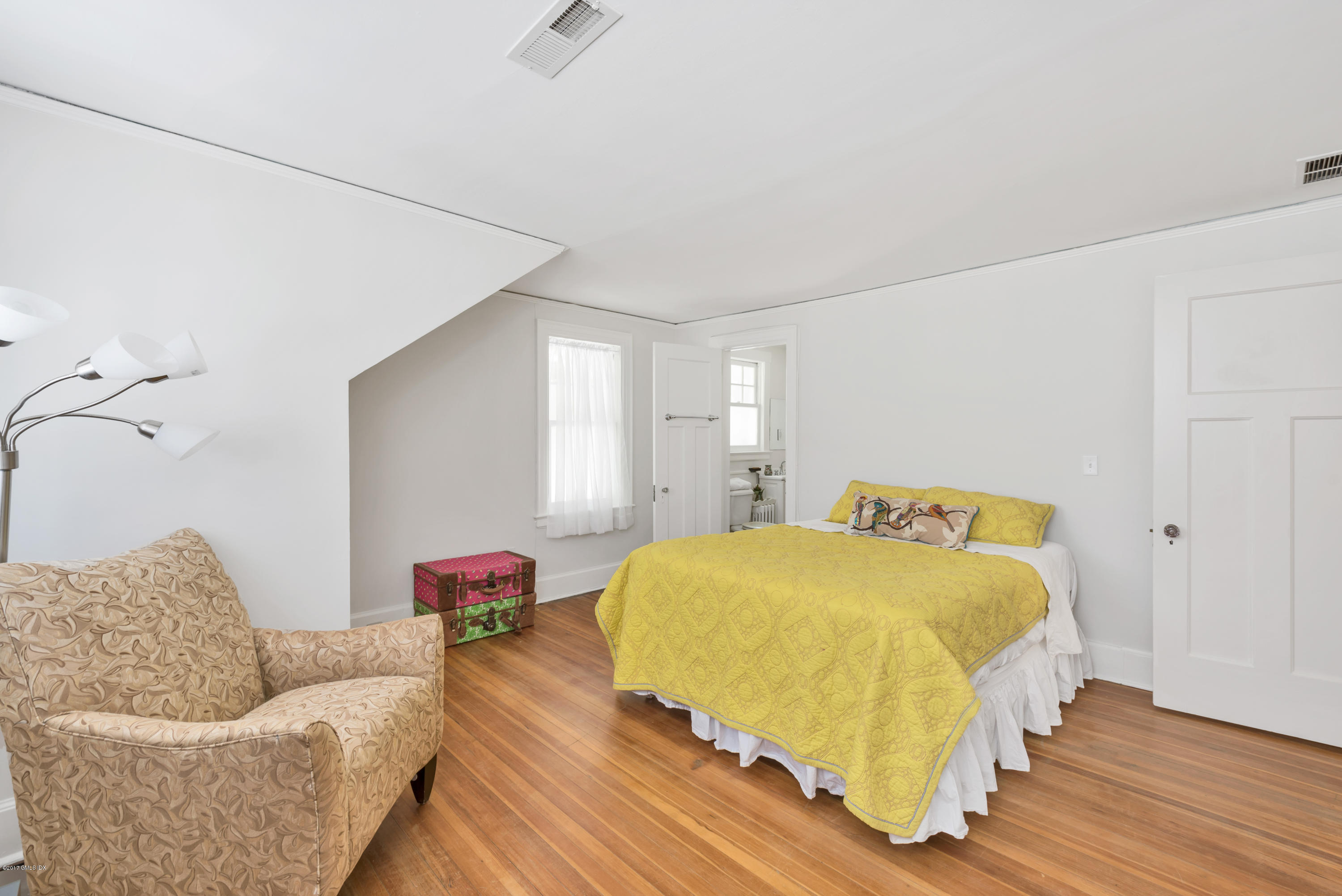57 Indian Field Road Greenwich, CT 06830 - Photo 17 of 24 a bedroom with a bed and couch