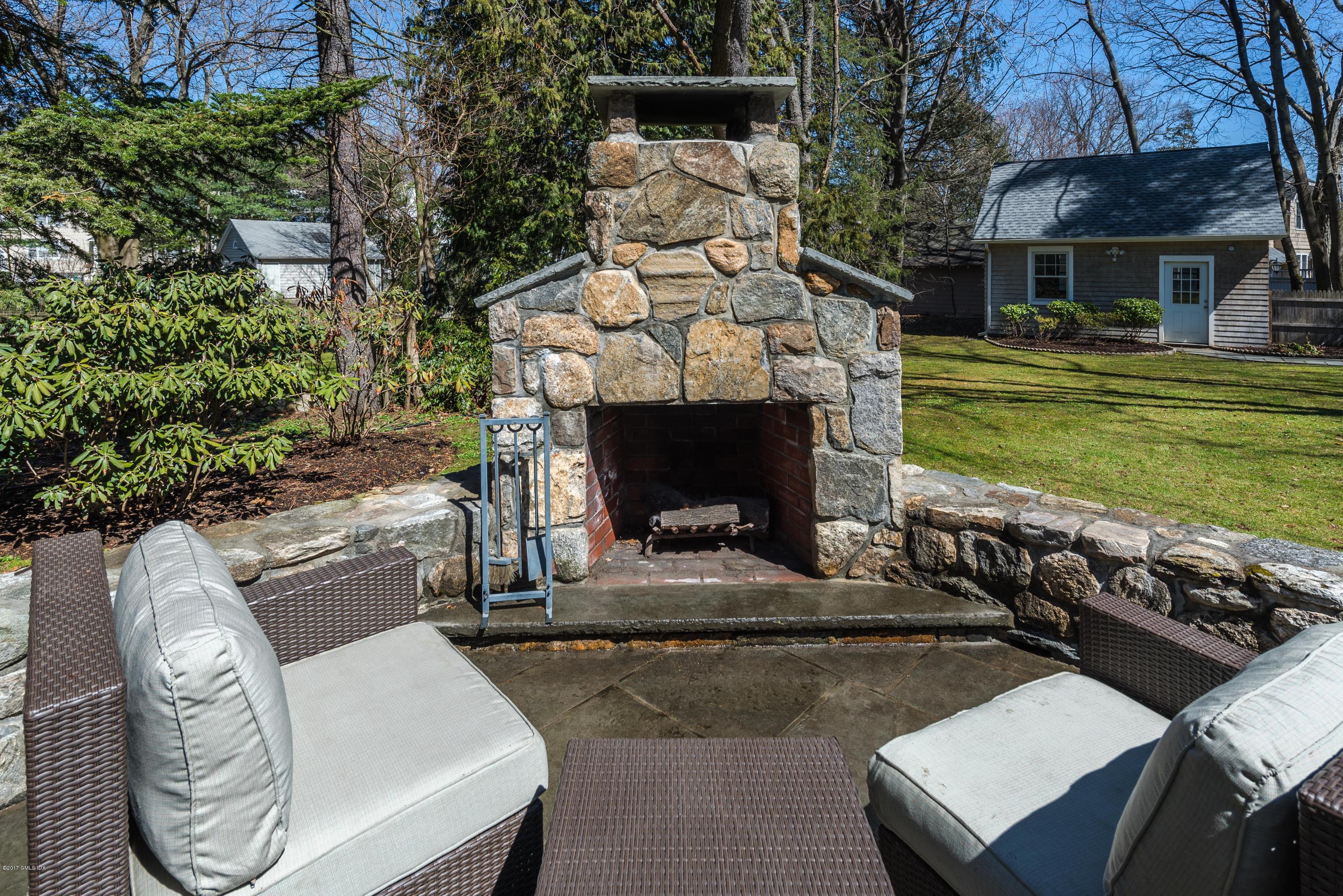 57 Indian Field Road Greenwich, CT 06830 - Photo 23 of 24 a front view of a house with garden