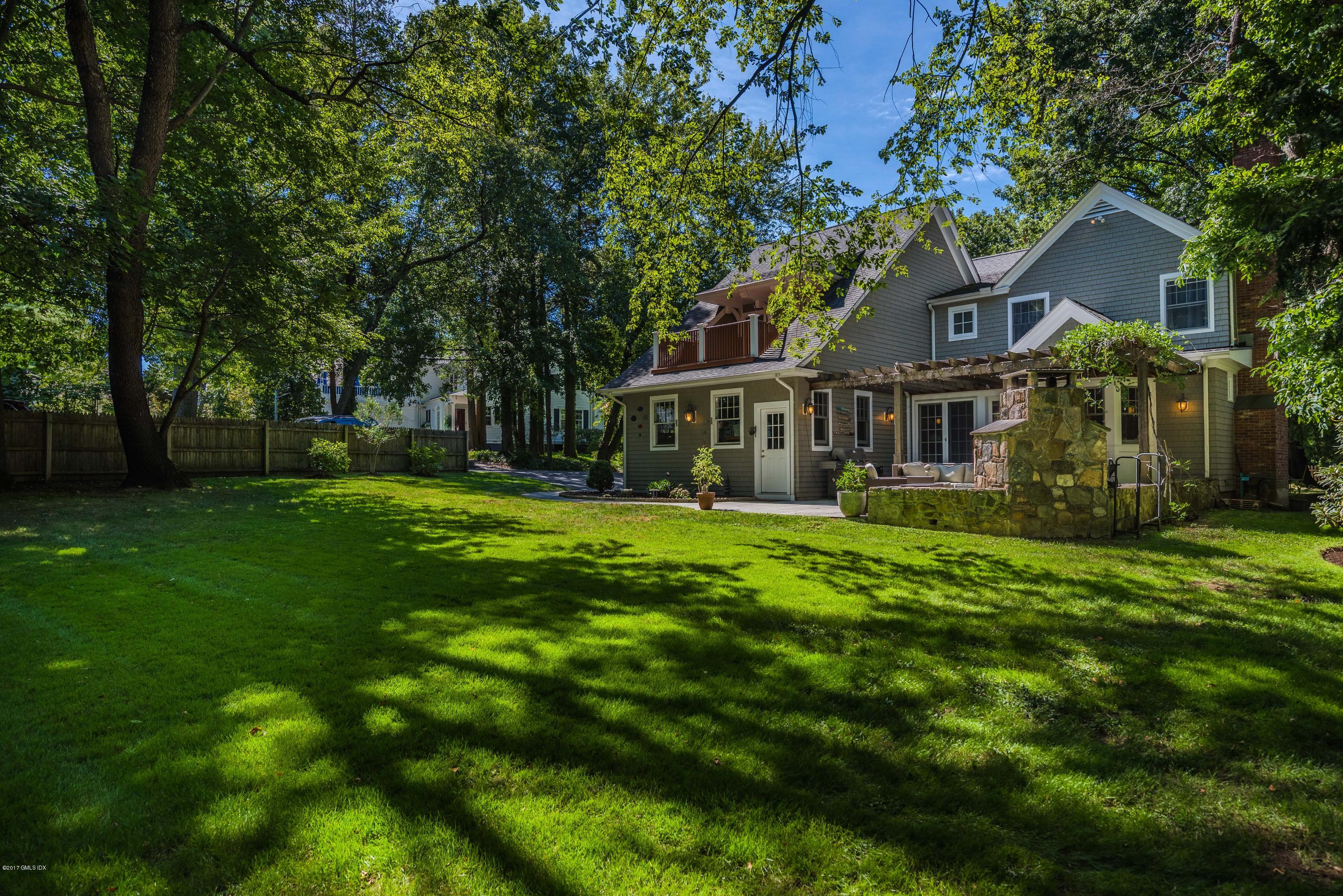 57 Indian Field Road Greenwich, CT 06830 - Photo 24 of 24 a front view of a house with a yard