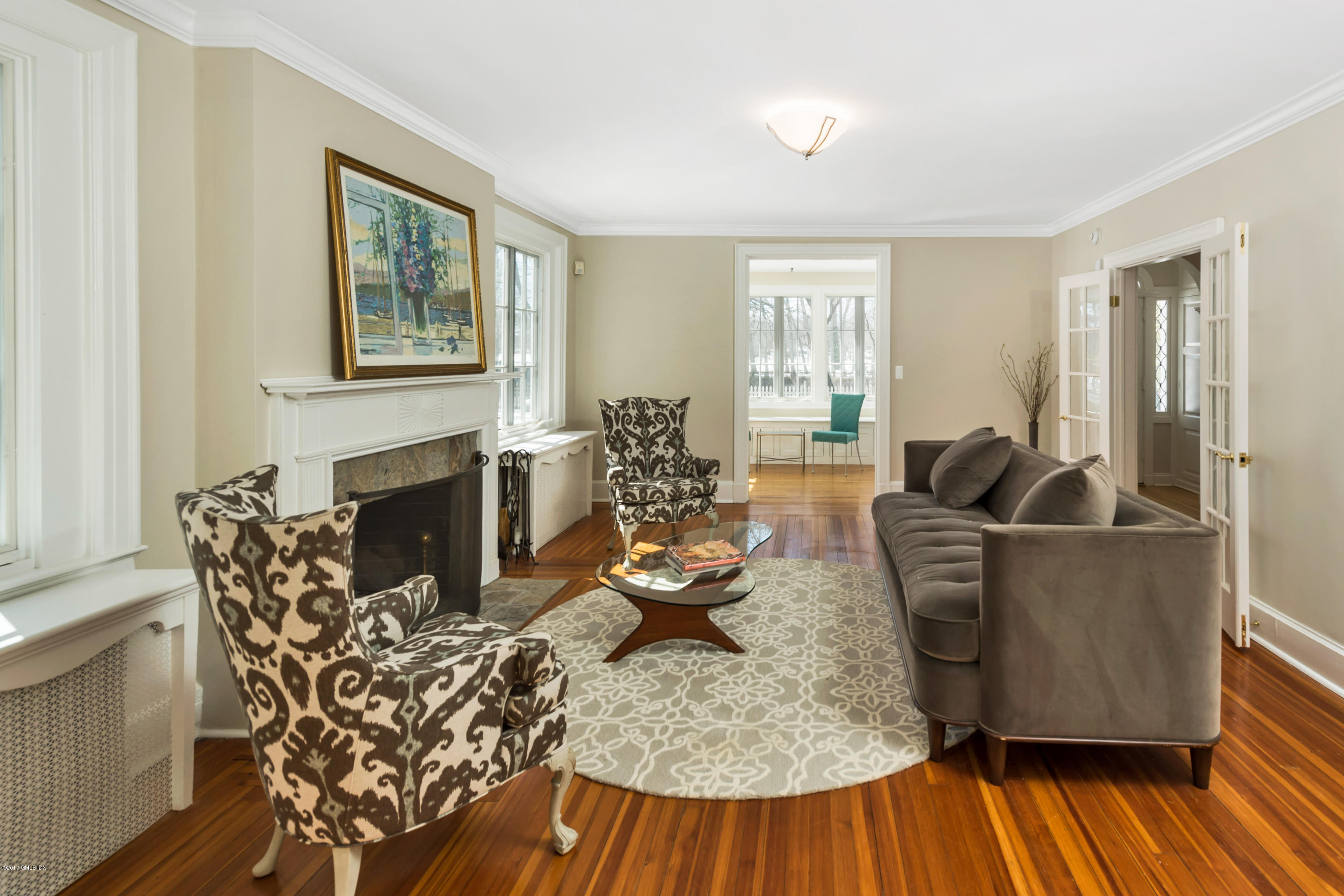 57 Indian Field Road Greenwich, CT 06830 - Photo 4 of 24 a living room with furniture and a fireplace