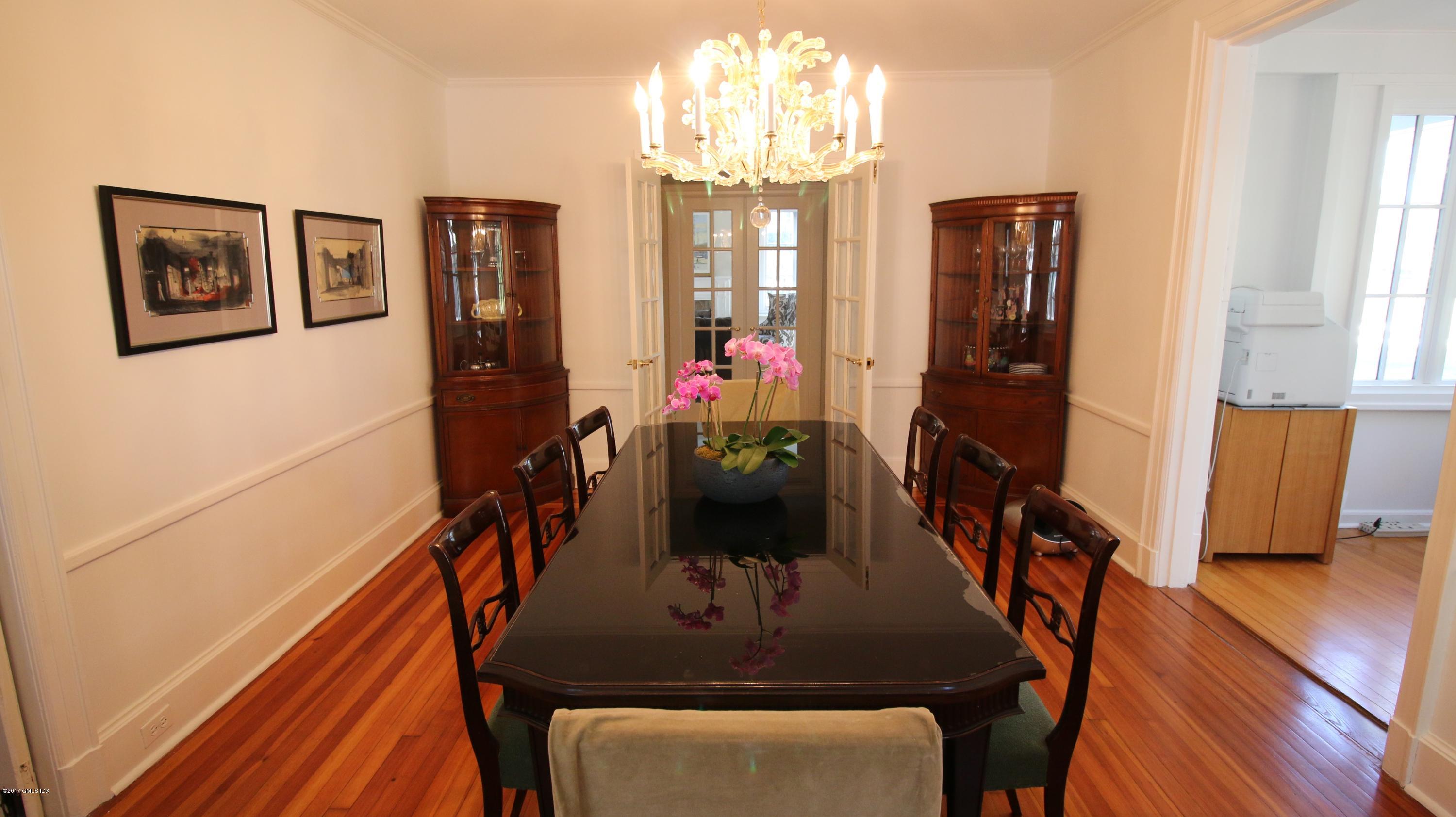 57 Indian Field Road Greenwich, CT 06830 - Photo 7 of 24 a view of a dining room with furniture and wooden floor