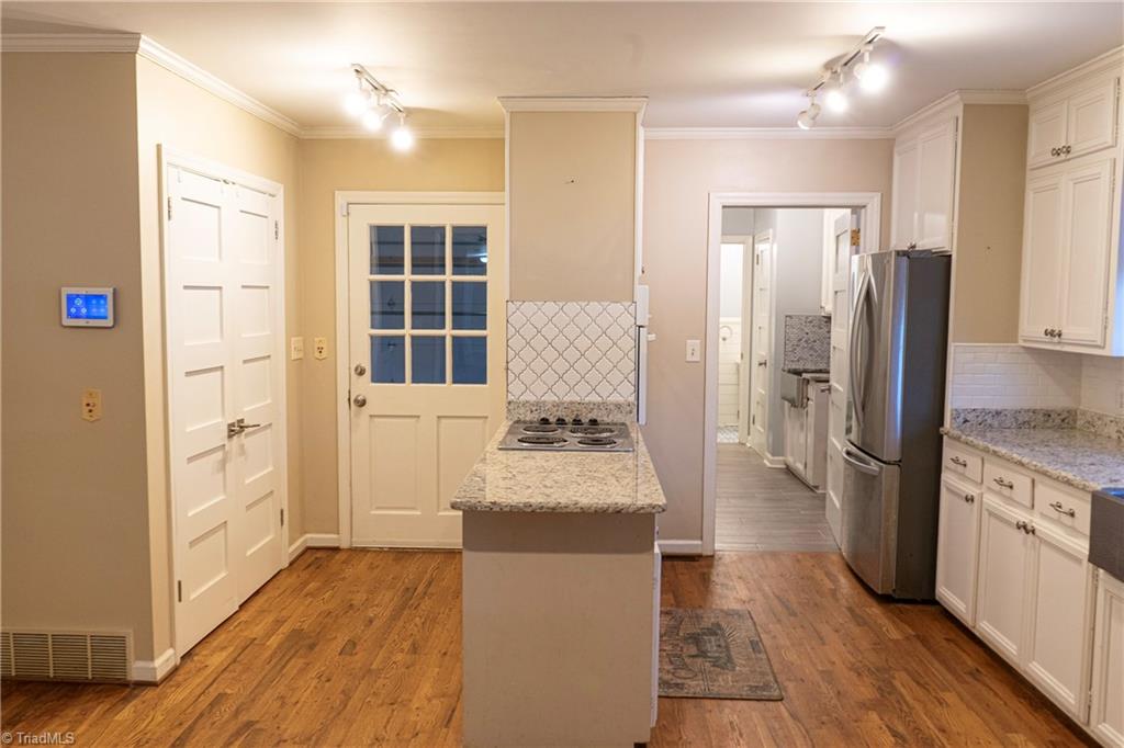 201 Partridge Lane Lexington, NC 27292 - Photo 15 of 40 Kitchen - looking towards Garage to the left and Laundry room and Full bathroom to the right.