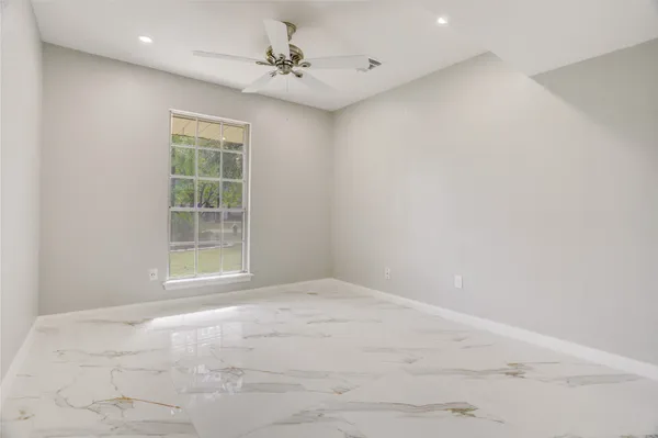 a view of an empty room with a window