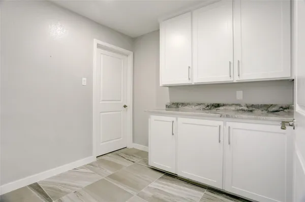 a view of cabinets with wooden floor