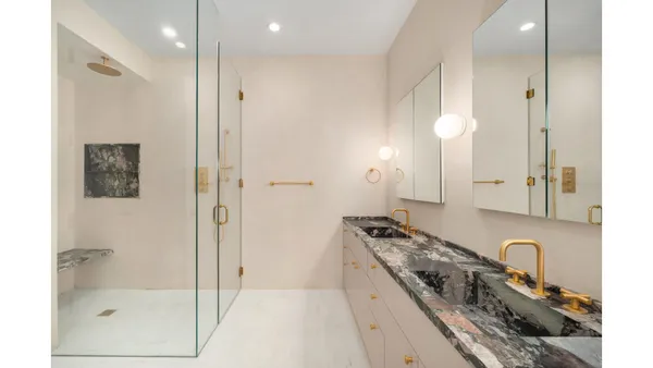 a kitchen with stainless steel appliances granite countertop a sink and a refrigerator
