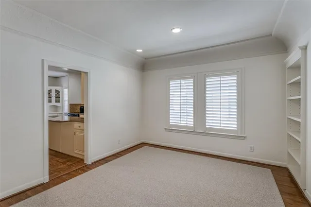 an empty room with windows and entrance