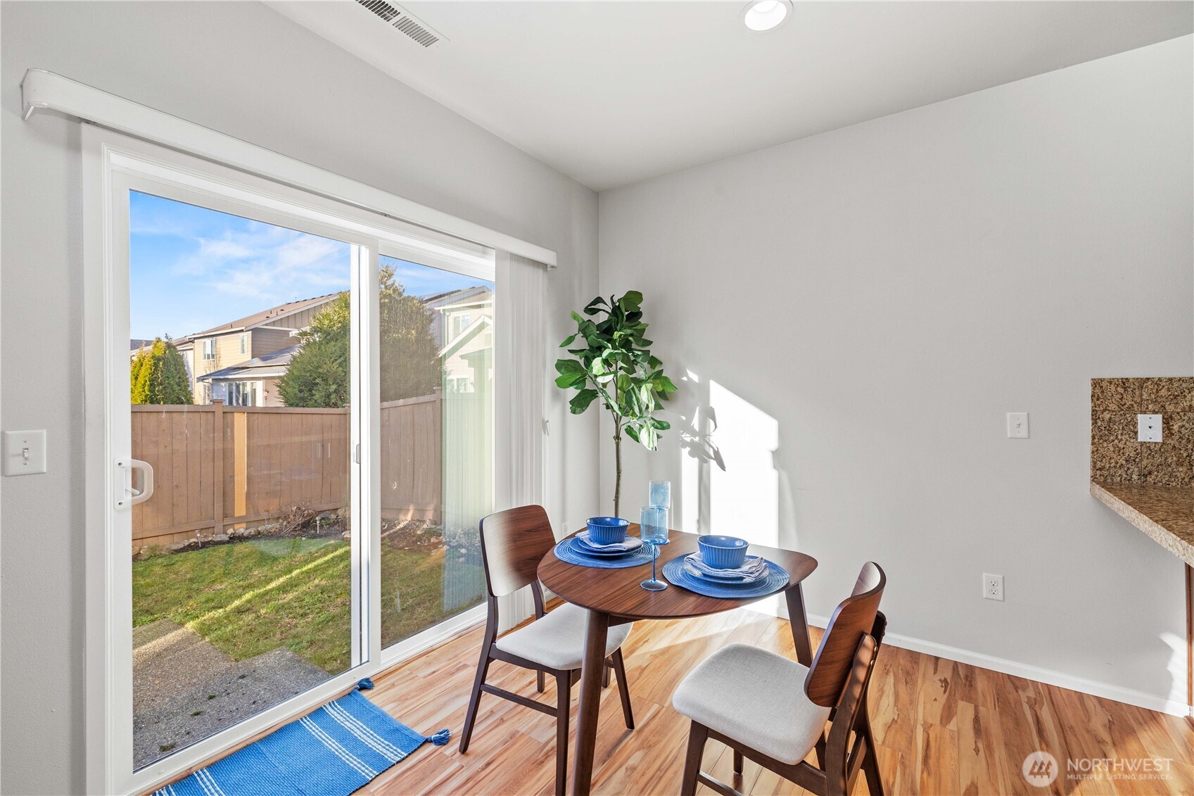 26219 243rd Place Southeast Maple Valley, WA 98038 - Photo 12 of 40 a dining room with furniture and wooden floor