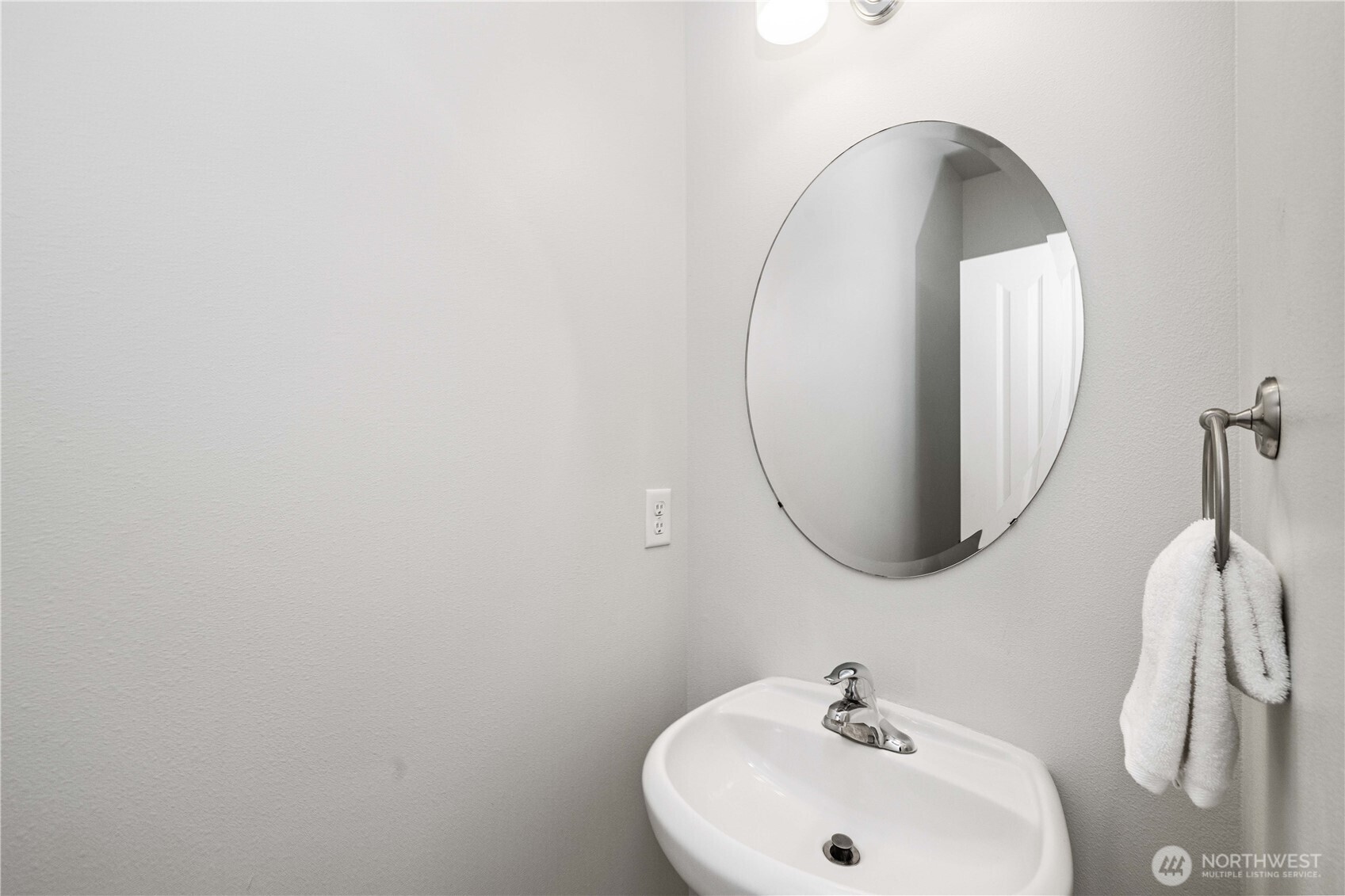 26219 243rd Place Southeast Maple Valley, WA 98038 - Photo 17 of 40 a bathroom with a sink and a mirror