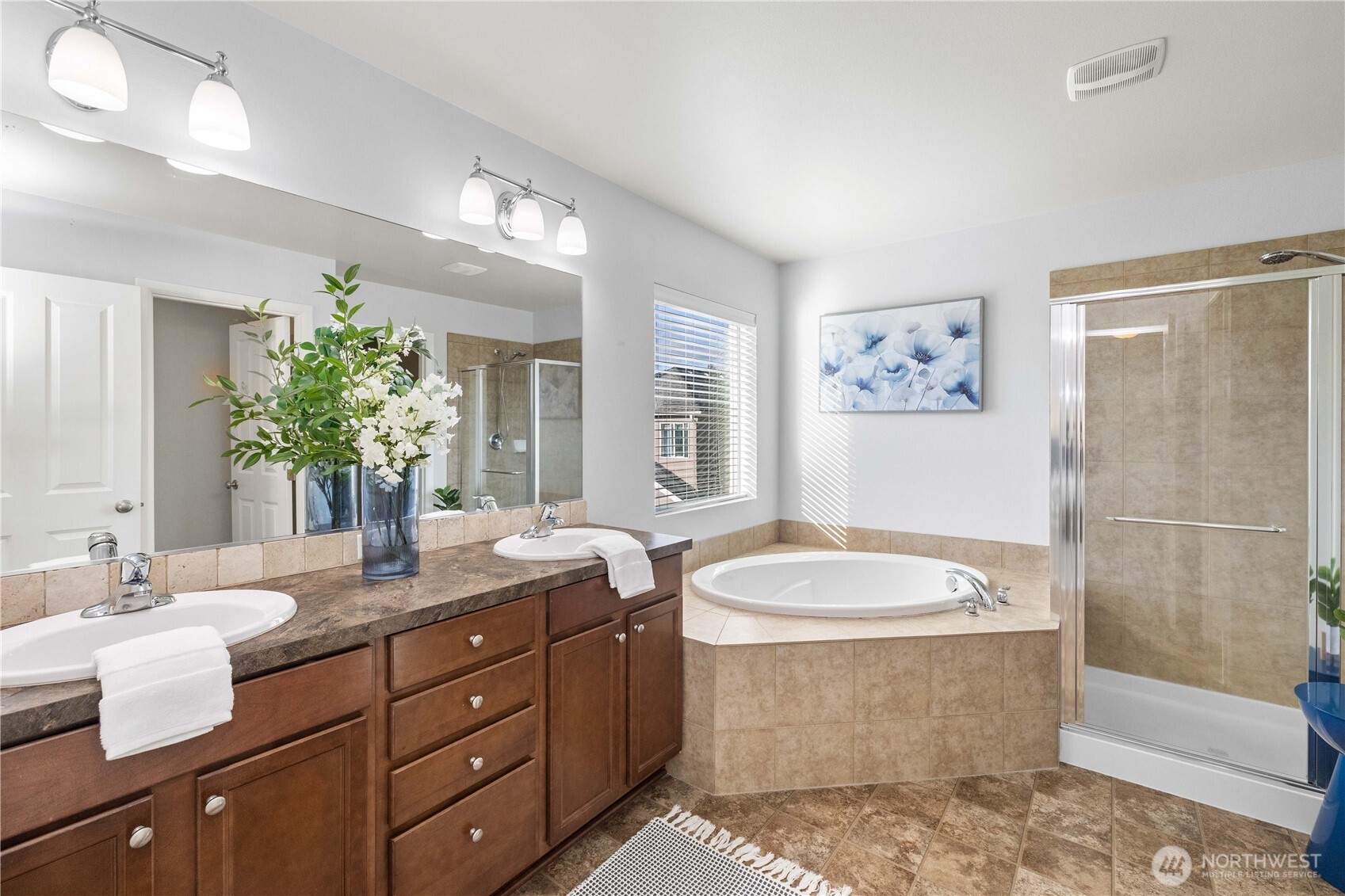 26219 243rd Place Southeast Maple Valley, WA 98038 - Photo 22 of 40 a bathroom with a granite countertop sink and a mirror