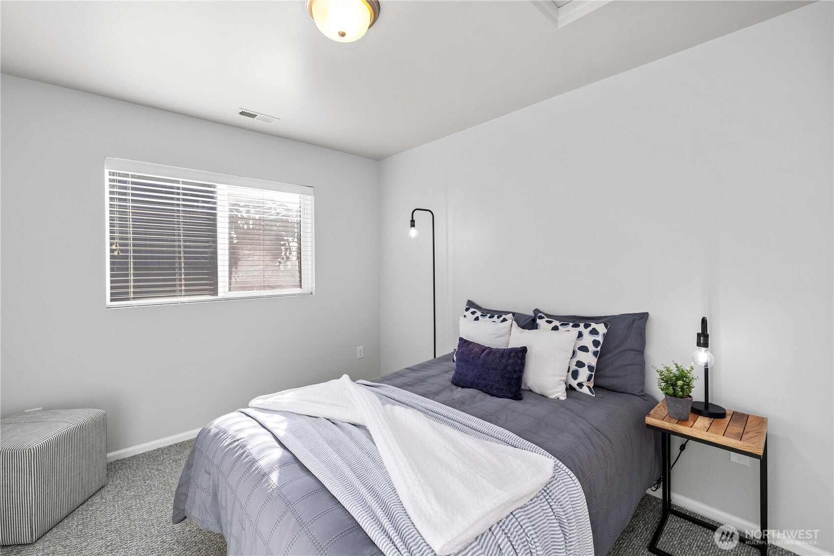 26219 243rd Place Southeast Maple Valley, WA 98038 - Photo 24 of 40 a bedroom with a bed and wooden floor