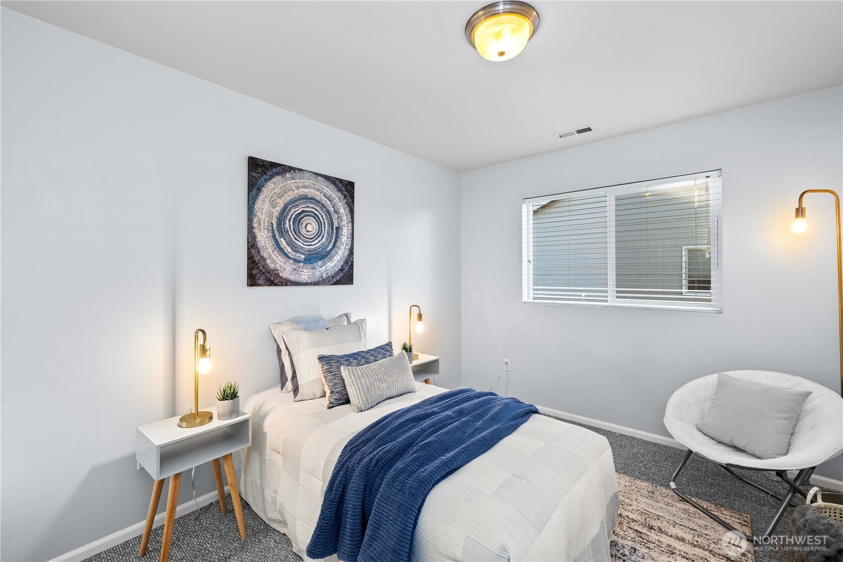 26219 243rd Place Southeast Maple Valley, WA 98038 - Photo 27 of 40 a bedroom with a bed and a lamp