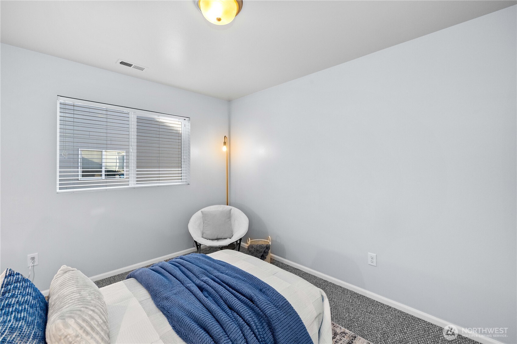 26219 243rd Place Southeast Maple Valley, WA 98038 - Photo 29 of 40 a bedroom with a bed and wooden floor