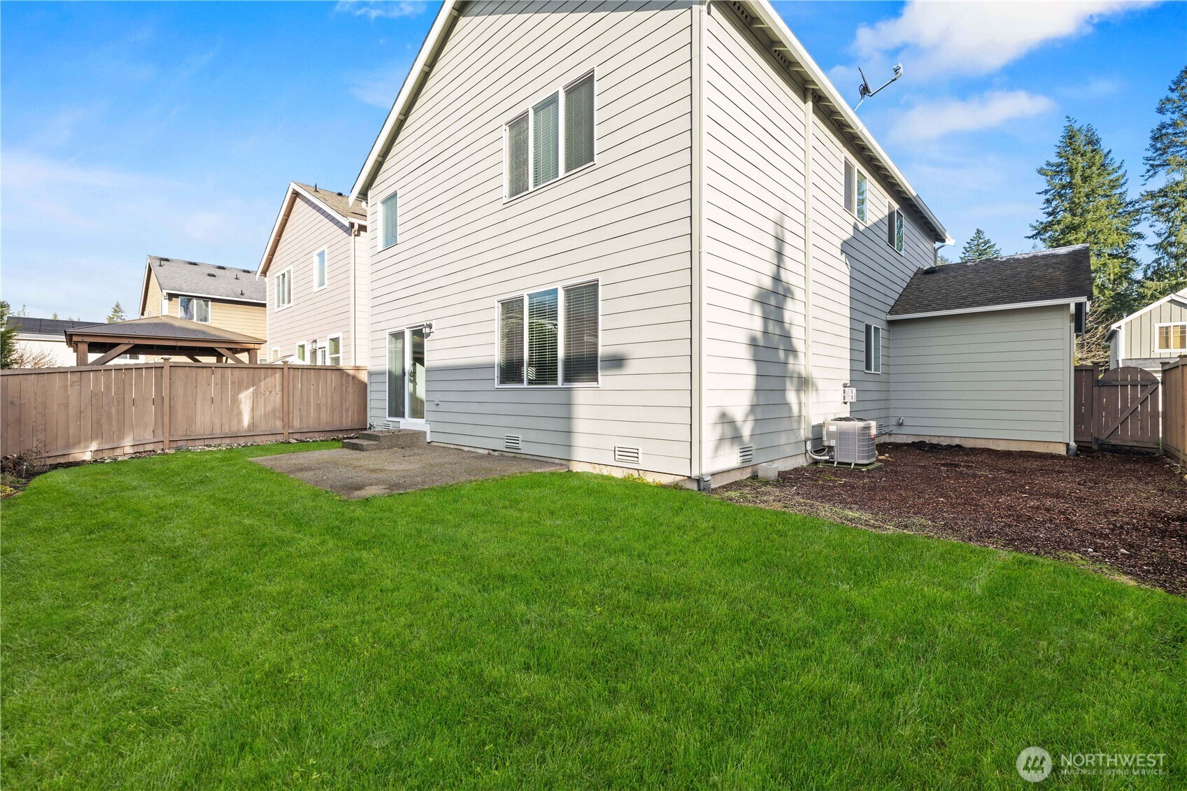 26219 243rd Place Southeast Maple Valley, WA 98038 - Photo 3 of 40 a front view of house with yard