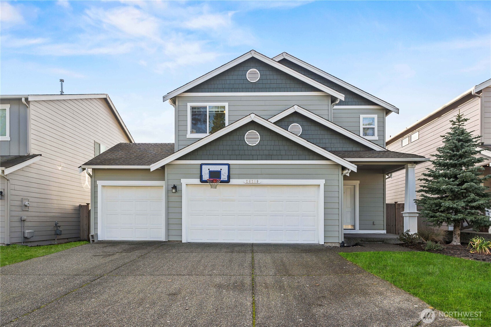 26219 243rd Place Southeast Maple Valley, WA 98038 - Photo 40 of 40 a front view of a house with a yard and garage