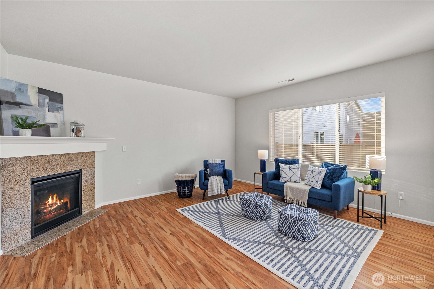 26219 243rd Place Southeast Maple Valley, WA 98038 - Photo 5 of 40 a living room with furniture and a fireplace