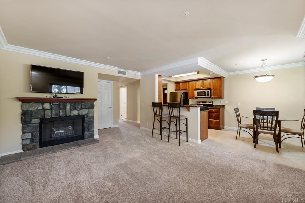 1434 Marshall Road, Unit 26 Alpine, CA 91901 - Photo 2 of 13 a view of a livingroom with furniture and a fireplace