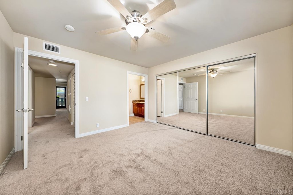 1434 Marshall Road, Unit 26 Alpine, CA 91901 - Photo 8 of 13 a view of an empty room with a ceiling fan