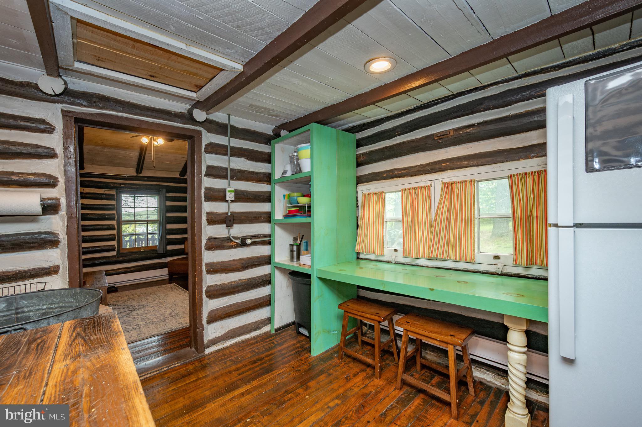560 Glendale Road Oakland, MD 21550 - Photo 13 of 24 a room with wooden furniture and a window