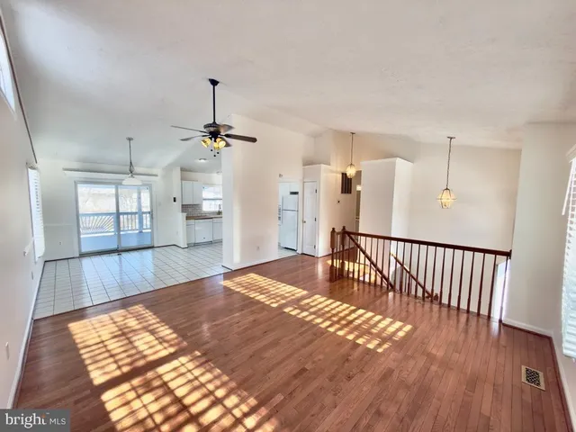 a view of a chairs and table in patio