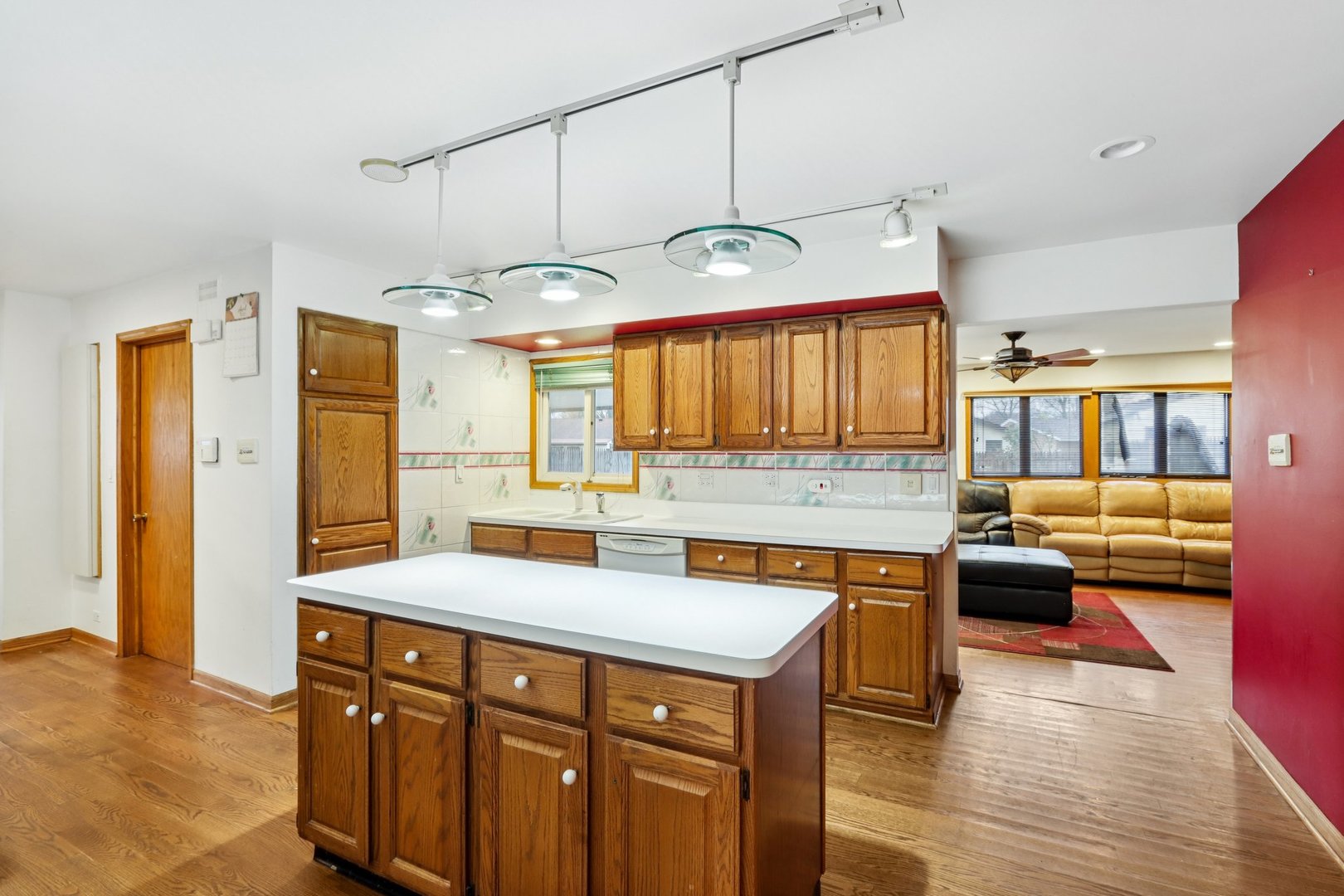 132 Tanglewood Drive Elk Grove Village, IL 60007 - Photo 11 of 42 a kitchen with a sink cabinets and wooden floor