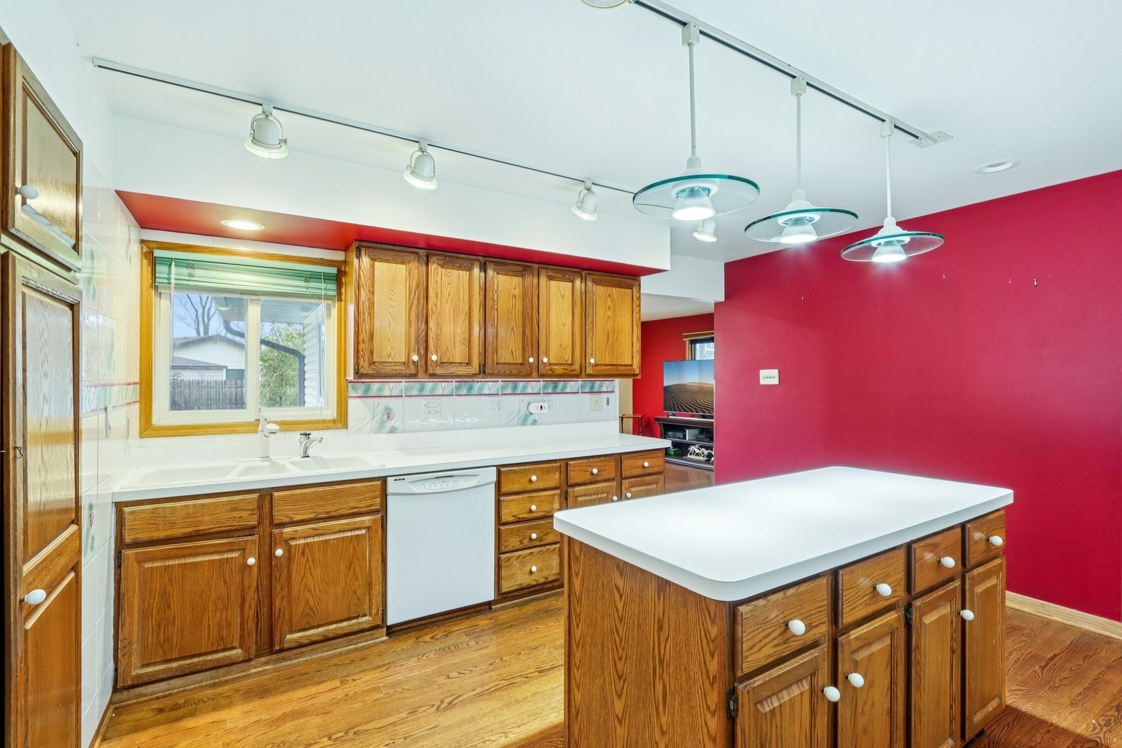 132 Tanglewood Drive Elk Grove Village, IL 60007 - Photo 14 of 42 a kitchen with a stove a sink dishwasher and a refrigerator