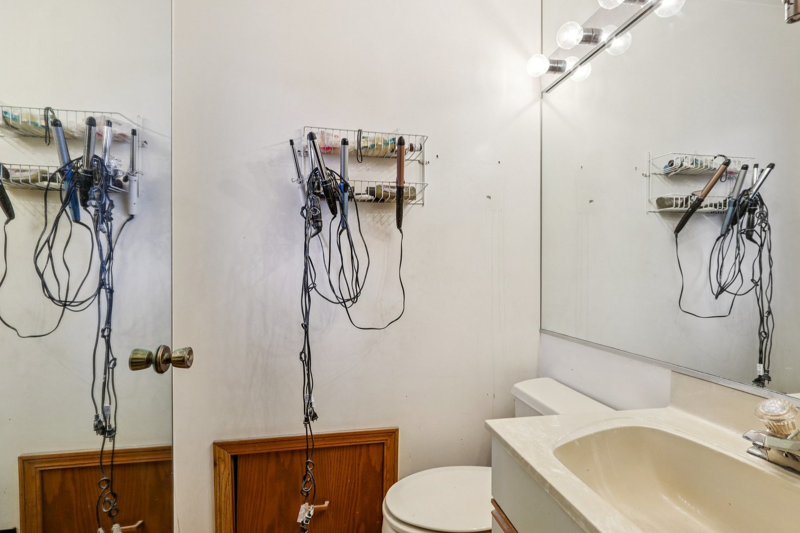 132 Tanglewood Drive Elk Grove Village, IL 60007 - Photo 19 of 42 a bathroom with a granite countertop sink a toilet and shower