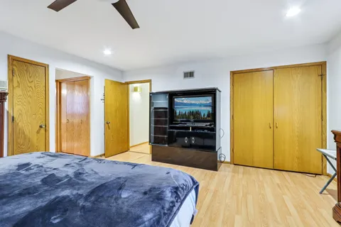 a bedroom with a bed and dresser