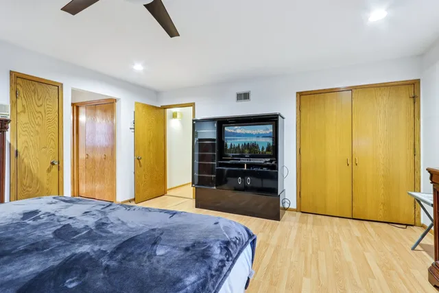 a bedroom with a bed and dresser