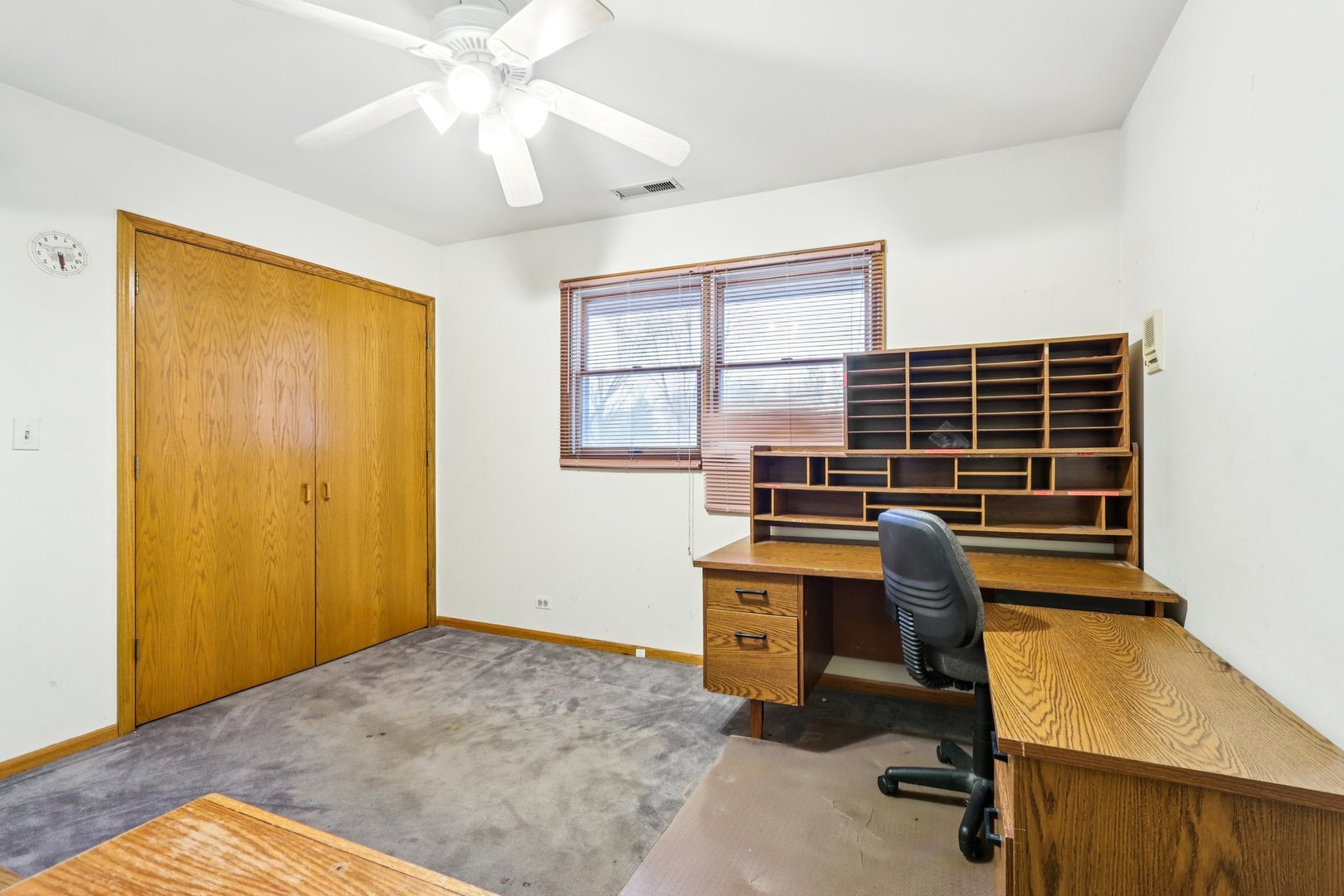 132 Tanglewood Drive Elk Grove Village, IL 60007 - Photo 23 of 42 a view of a workspace with furniture and a window