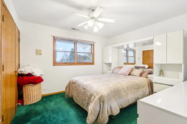 a bed room with a bed and a chandelier