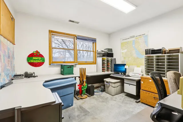 a room with furniture a flat screen tv and a table