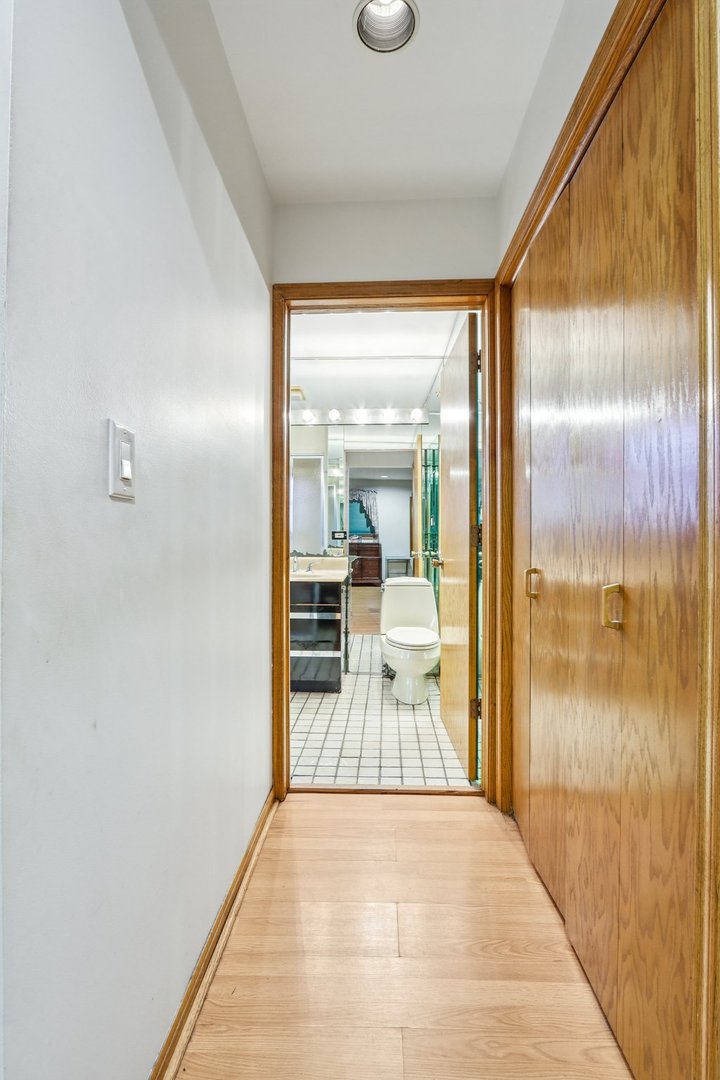132 Tanglewood Drive Elk Grove Village, IL 60007 - Photo 34 of 42 a view of a room with wooden floor and windows