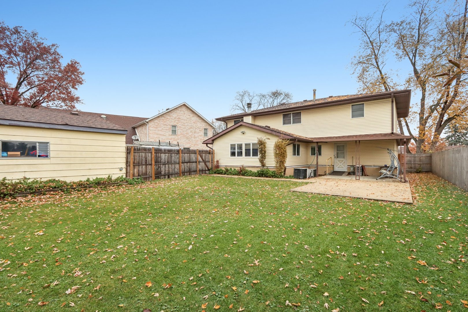 132 Tanglewood Drive Elk Grove Village, IL 60007 - Photo 36 of 42 a view of a house with a yard and sitting area