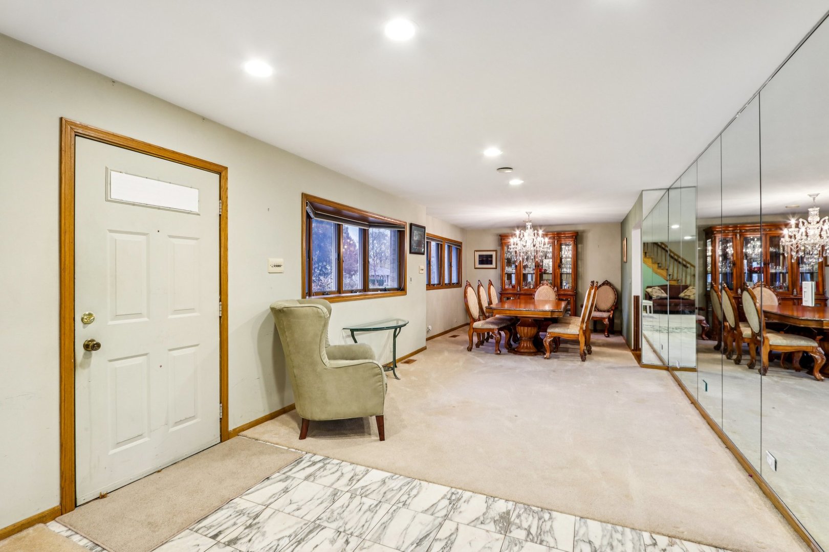 132 Tanglewood Drive Elk Grove Village, IL 60007 - Photo 5 of 42 a living room with furniture and a dining table with potted plant
